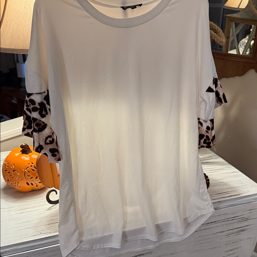 Gameday Couture Cream Top with leopard accent on sleeves